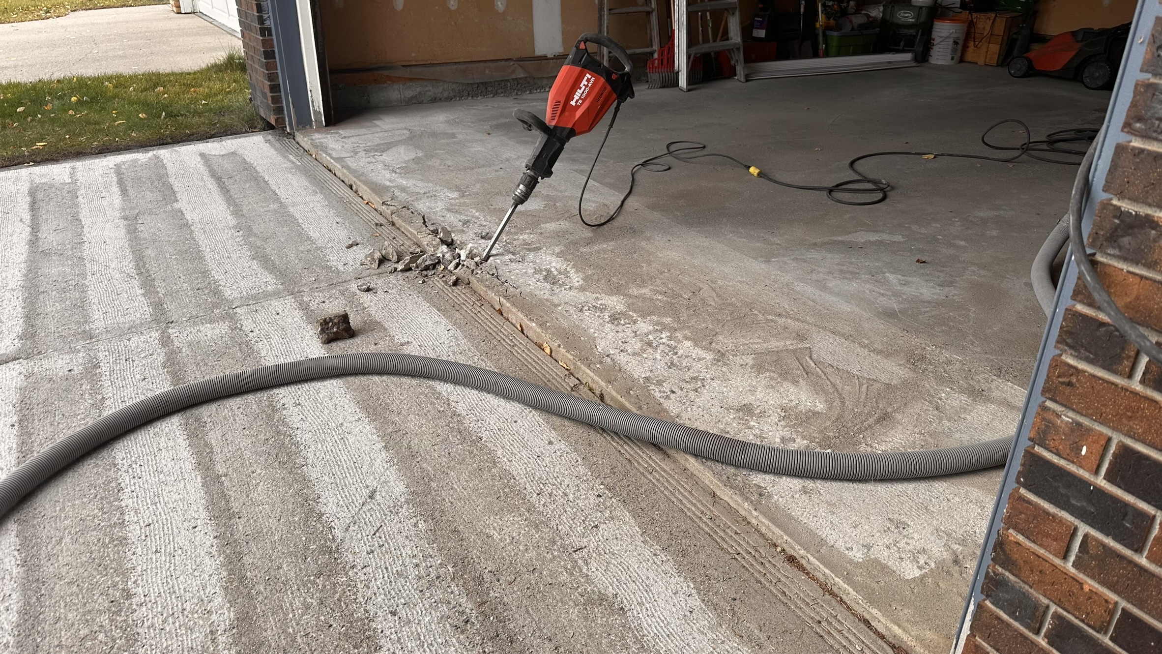 Concrete Repair Services Jacksonville, FL | Con Cure USA IMG 8217 Freshly poured concrete repair and floor in a garage, showing a mix of smooth and rough patches