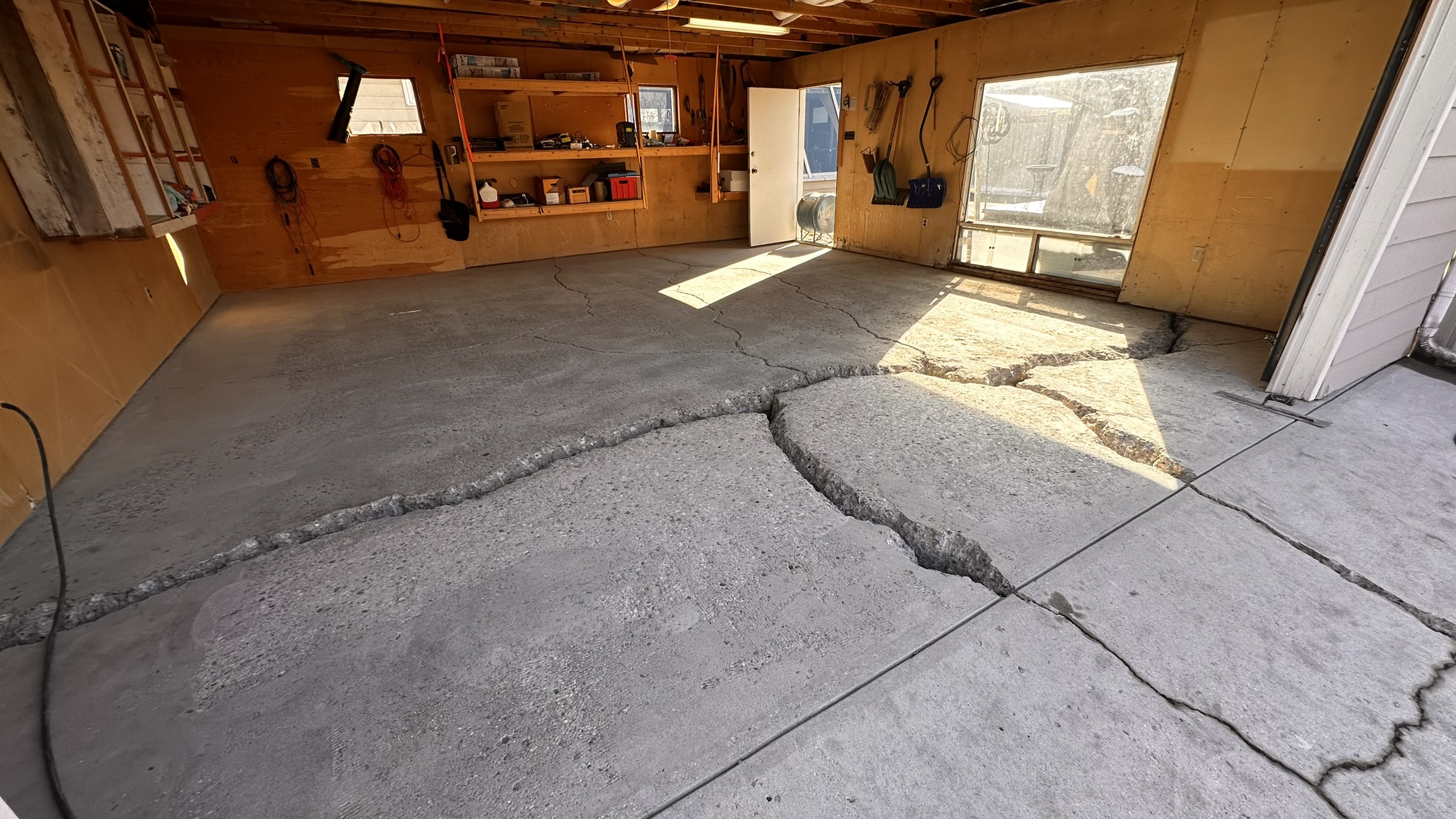 Concrete Repair Services Jacksonville, FL | Con Cure USA IMG 8589 Freshly poured concrete repair and floor in a garage, showing a mix of smooth and rough patches