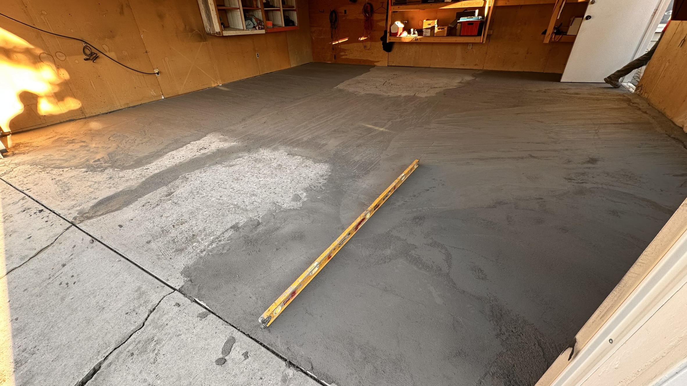 Concrete Repair Services Jacksonville, FL | Con Cure USA IMG 8590 Freshly poured concrete repair and floor in a garage, showing a mix of smooth and rough patches